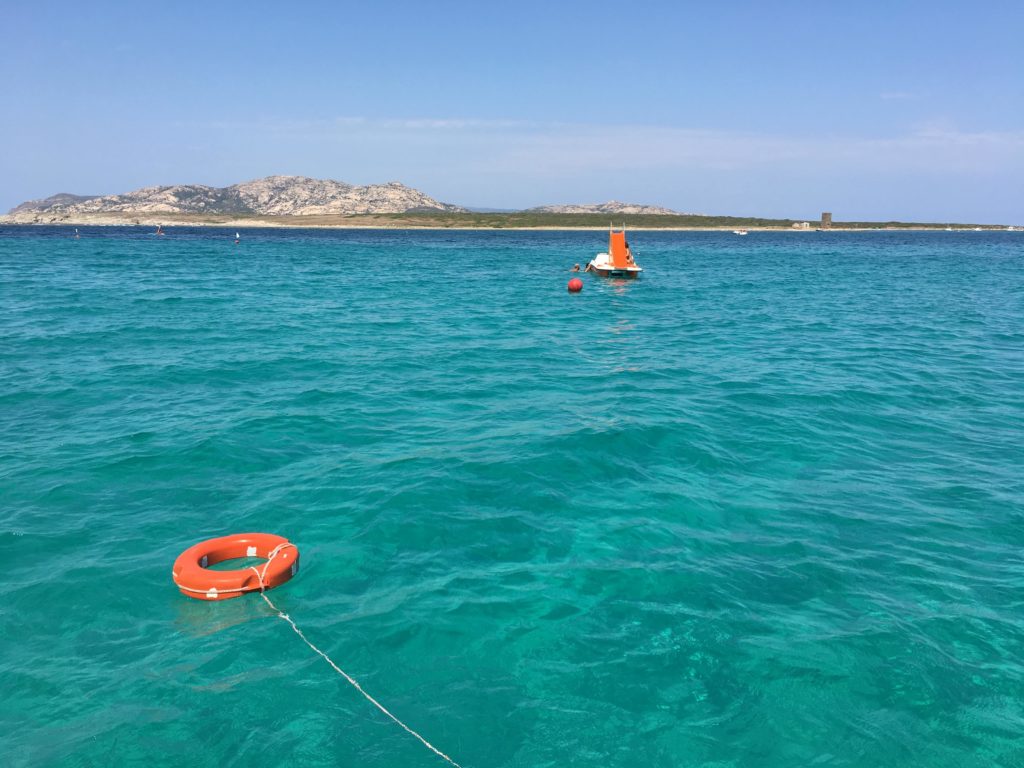 Paddle boat with slide rentals are very fun in La Pelosa Beach, Sardinia with kids