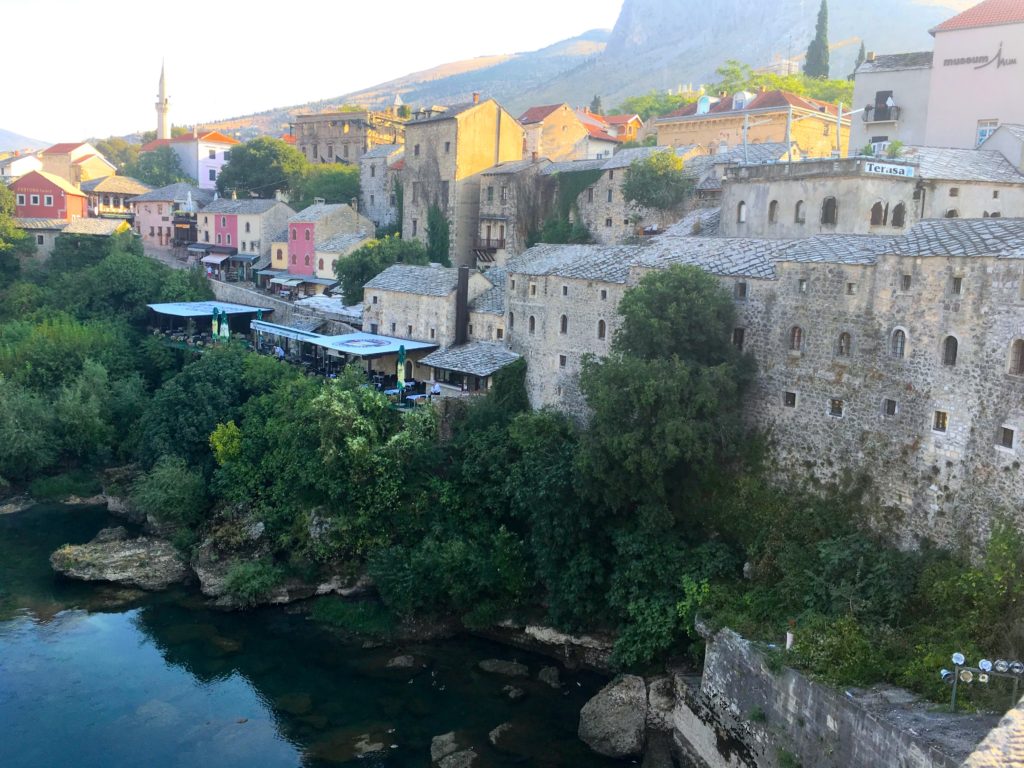 Historical houses and mosque on the banks of the River Neretva in Mostar